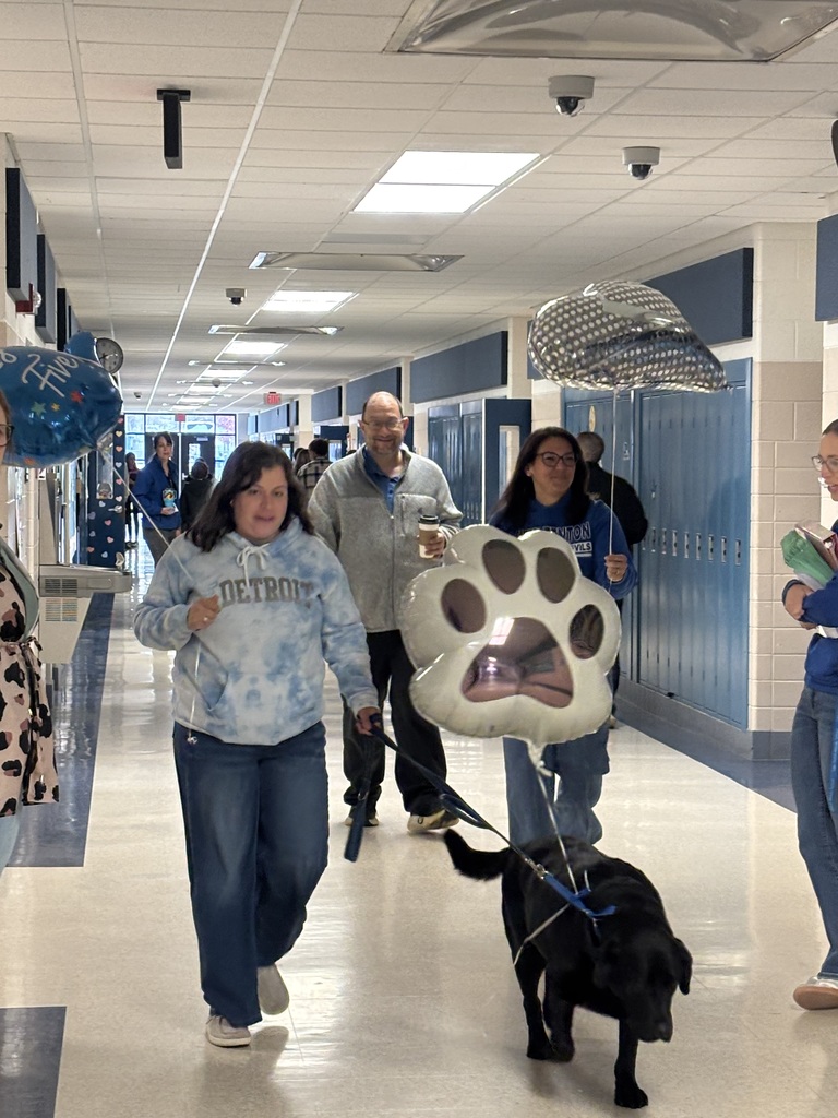 teachers walking down the hall with balloons