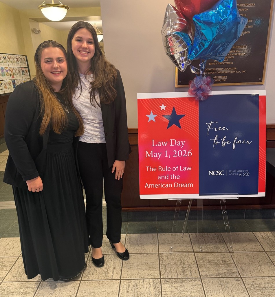high school students posing in front of Law Day 2026 sign