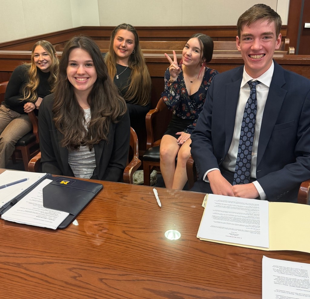high school students posing in a court room