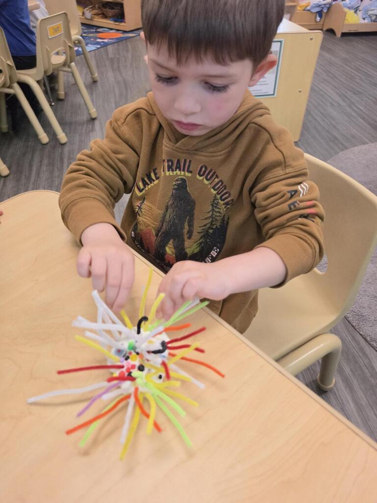 preschool student doing a craft