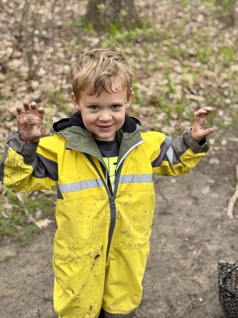 Boy posing in yellow rain suit