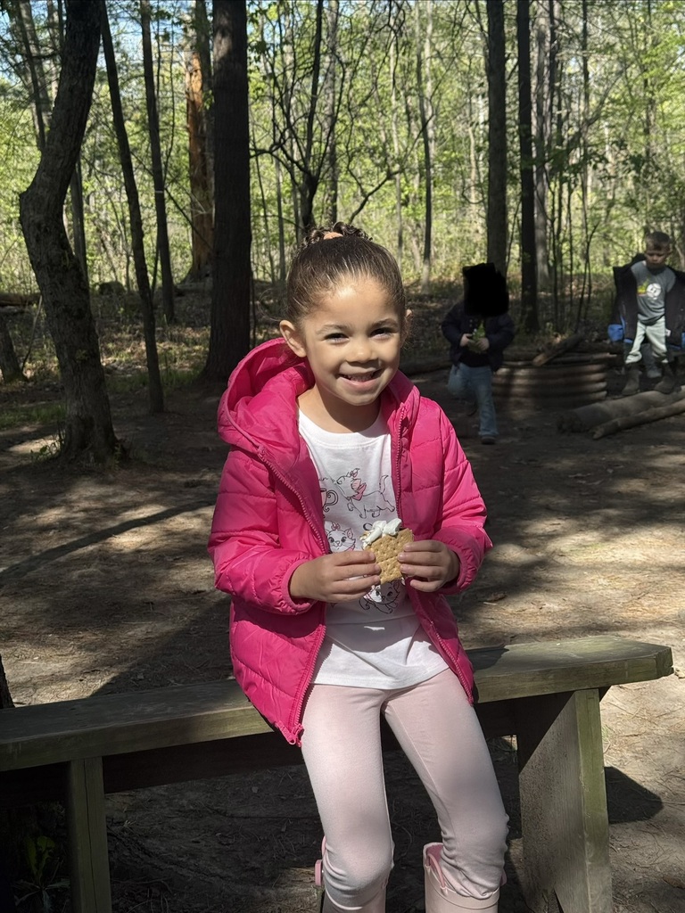 little girl eating a s'more