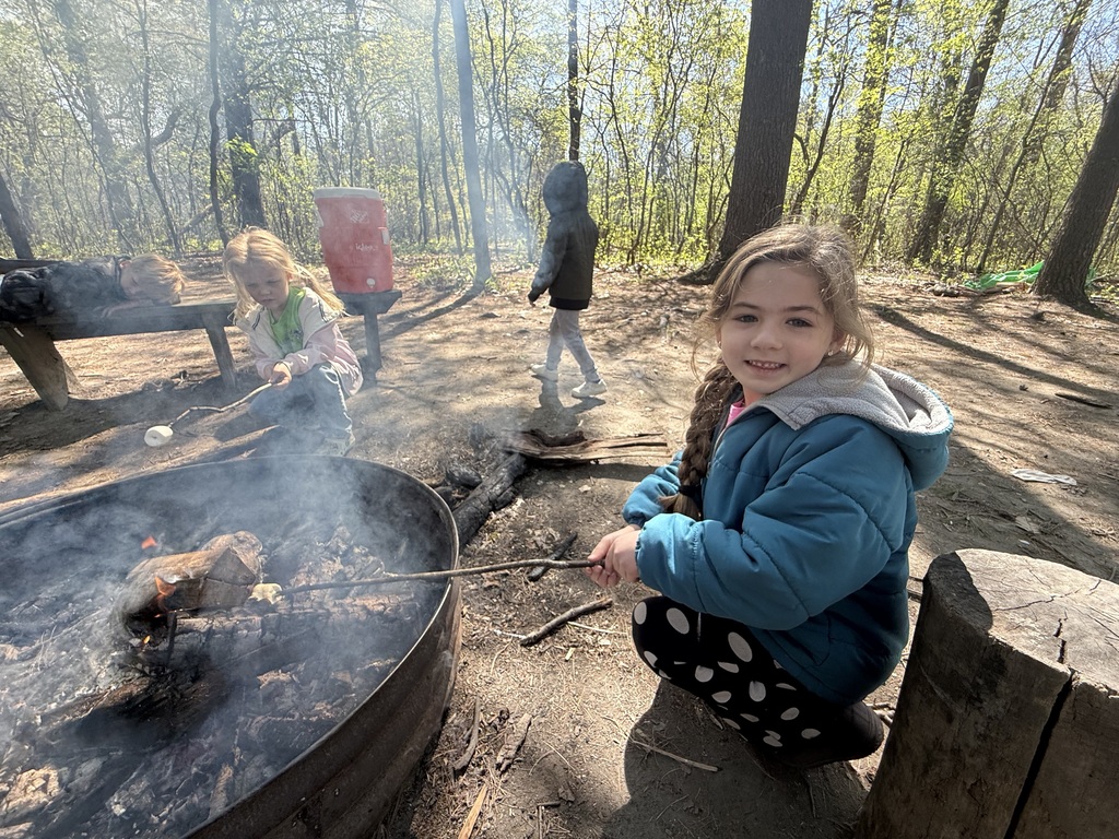 little girl roasting marshmallows