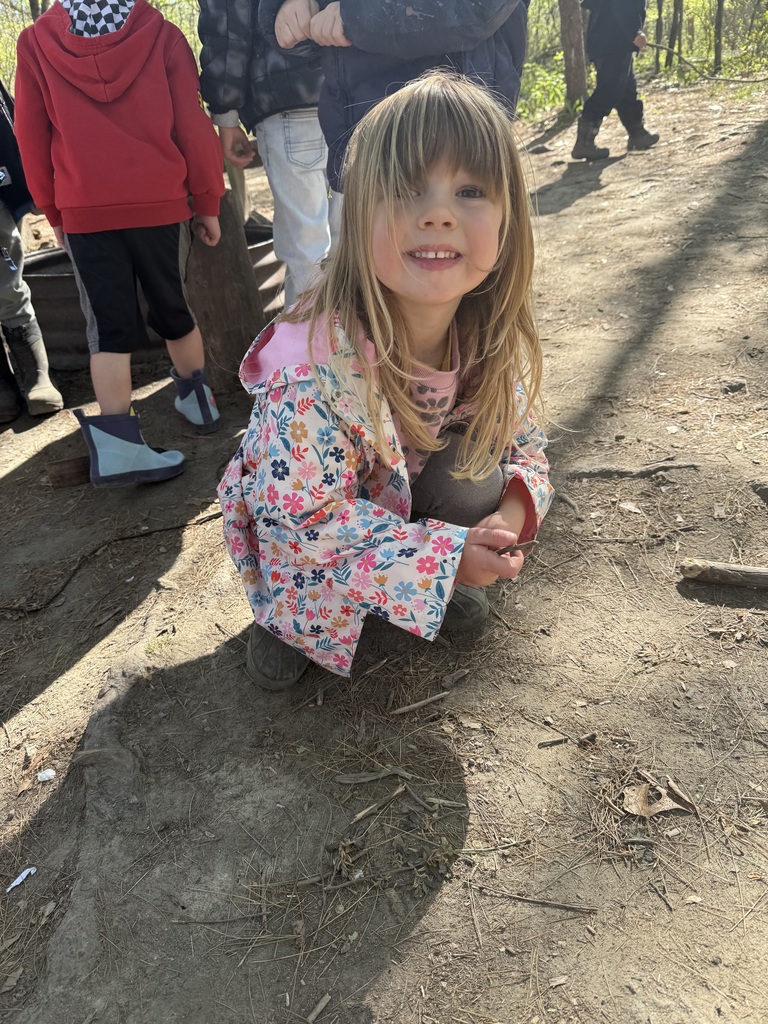 little girl posing outside