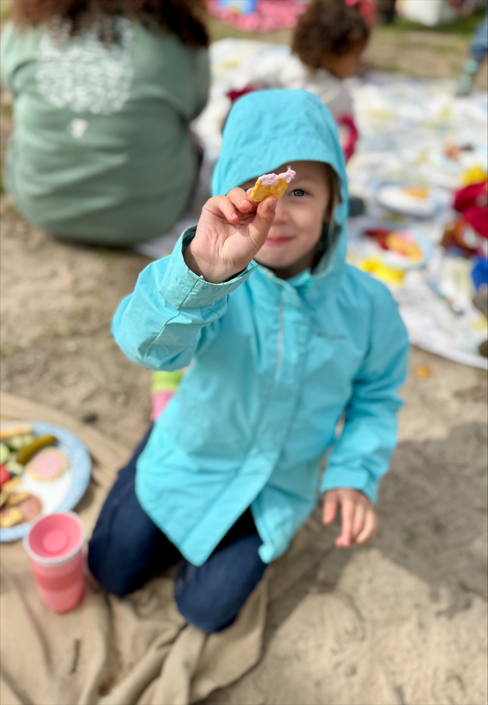 girl holding a cracker