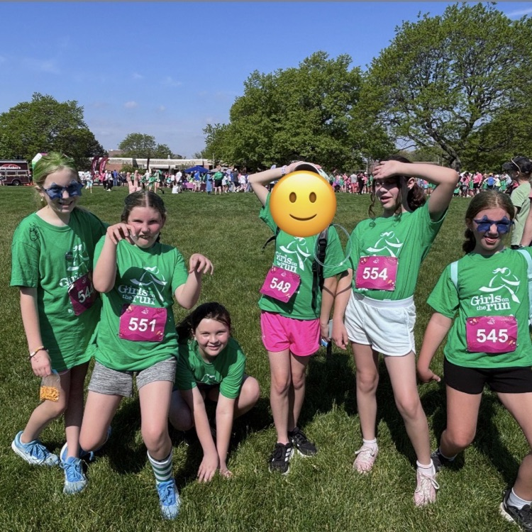 girls posing in green shirts