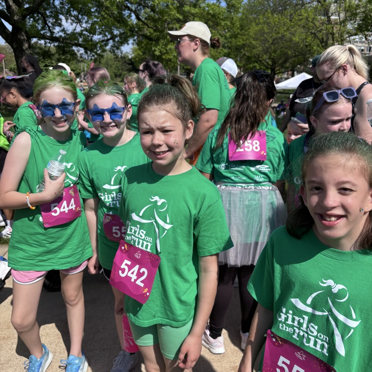 girls posing in green shirts