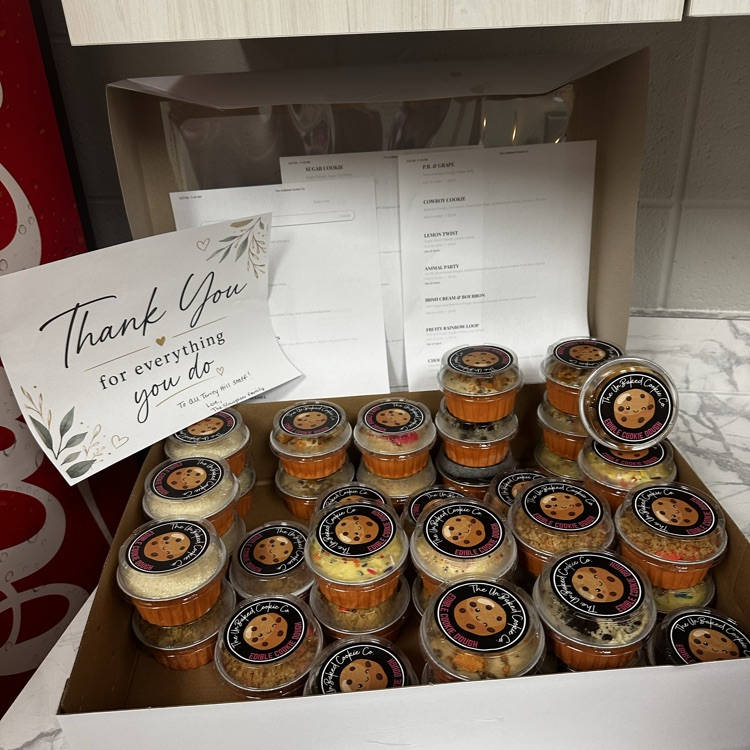 tray of desserts with a thank you note 