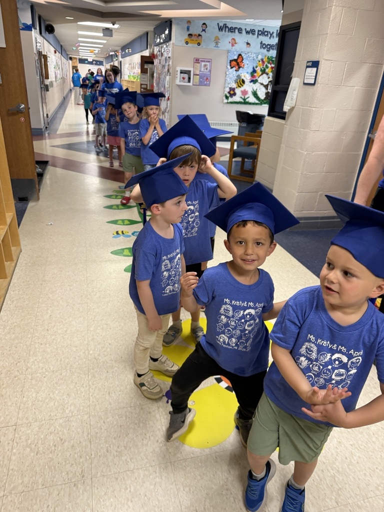 preschoolers in blue graduation caps