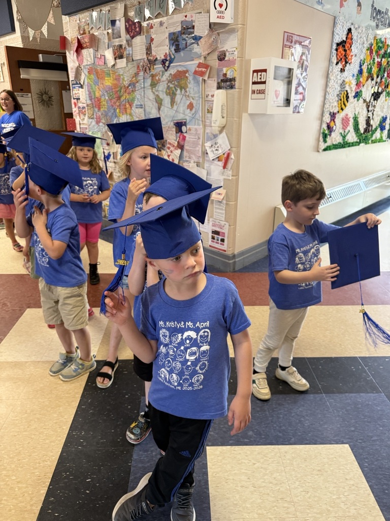 preschoolers in blue graduation caps