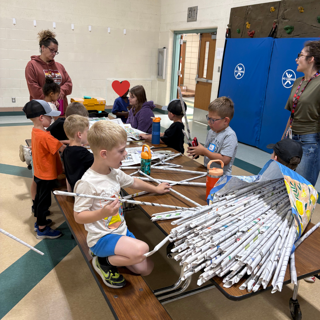 kids doing crafts in a gym