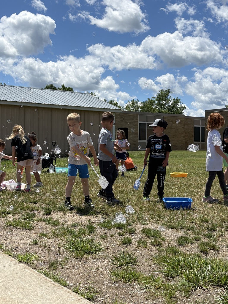 kids playing with bubbles outdoors
