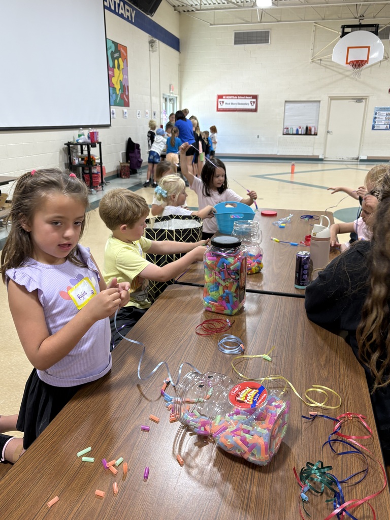 kids doing crafts in a gym
