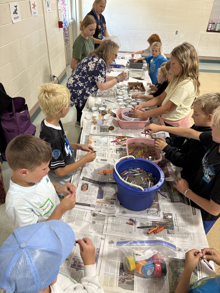 kids doing crafts in a gym