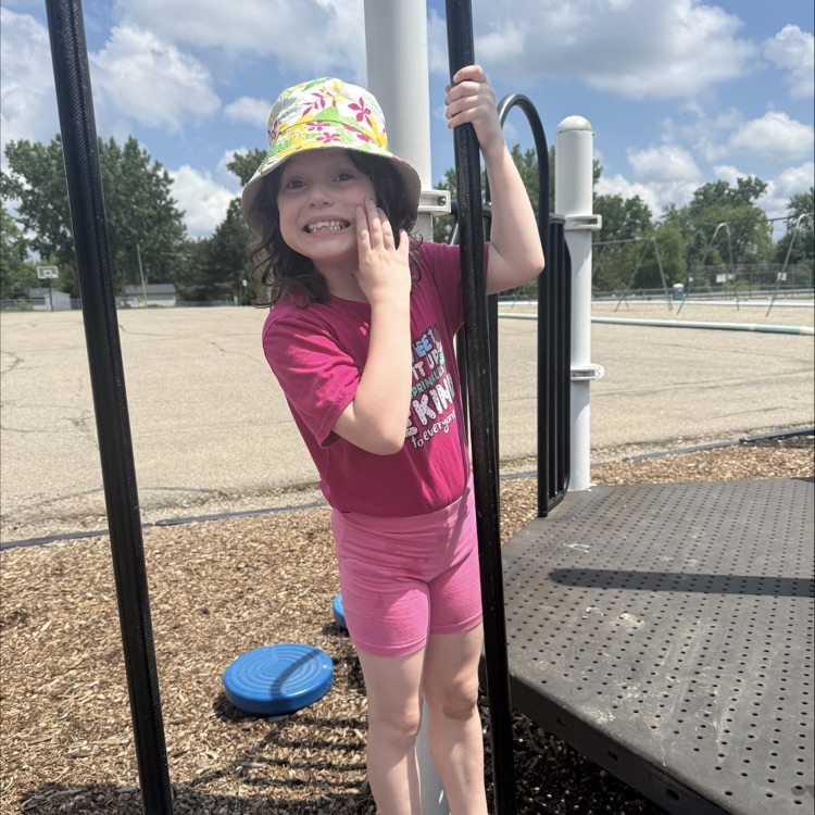 little girl playing on playground