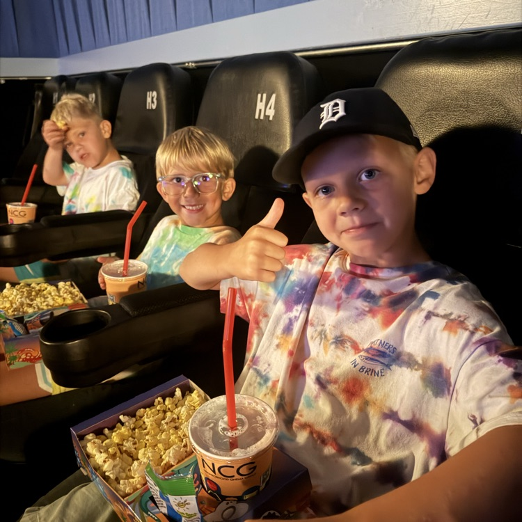 3 boys in a movie theater