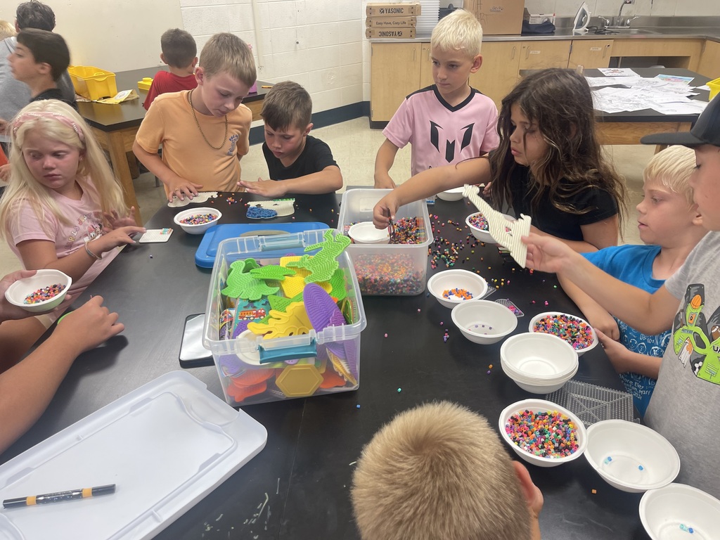 kids making crafts at a table