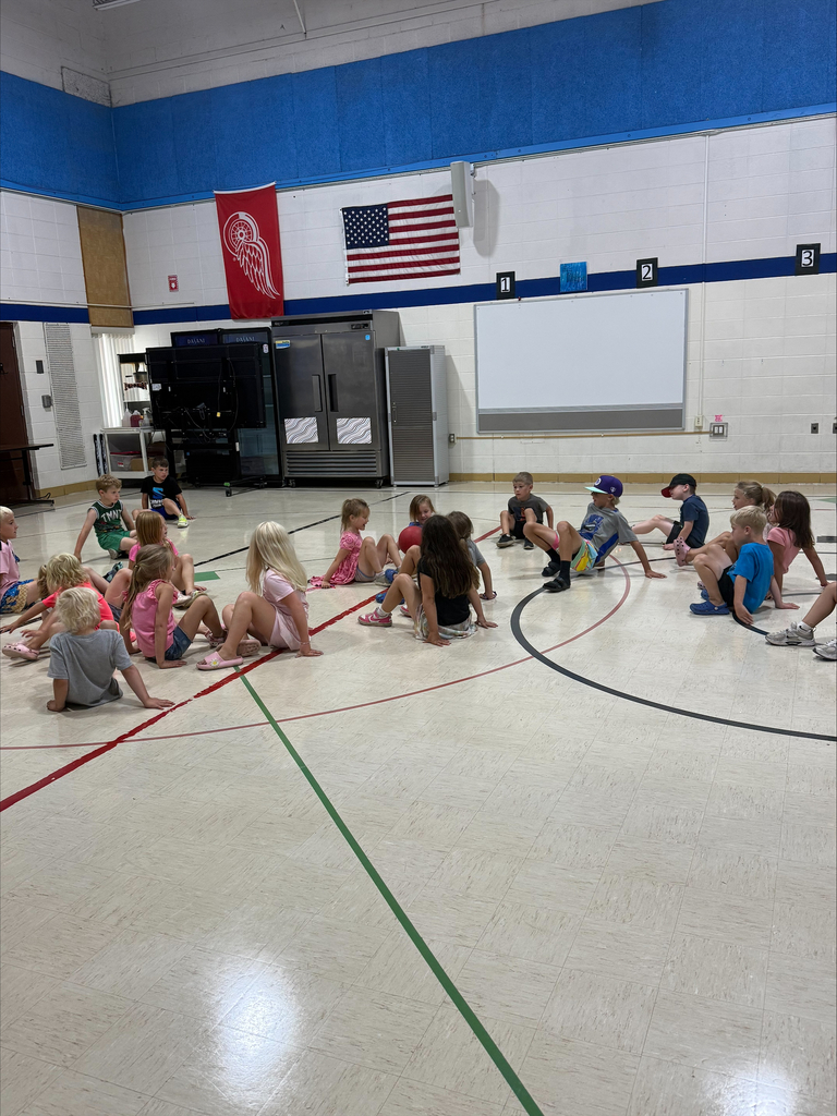 kids playing on a gym floor