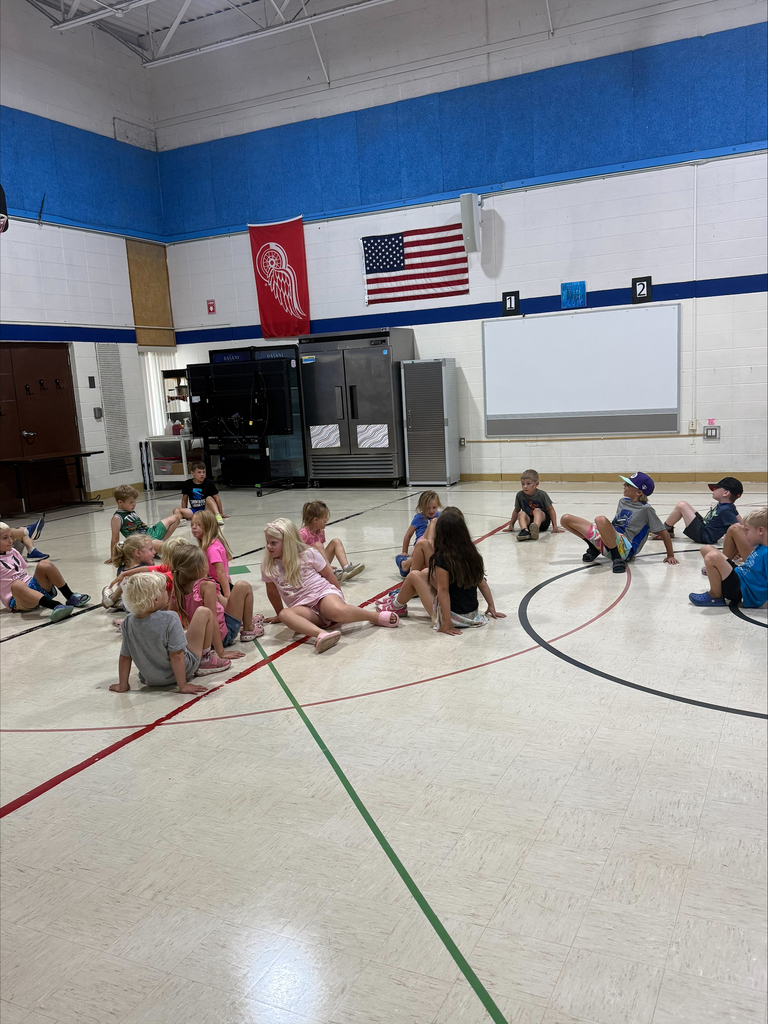kids playing on a gym floor