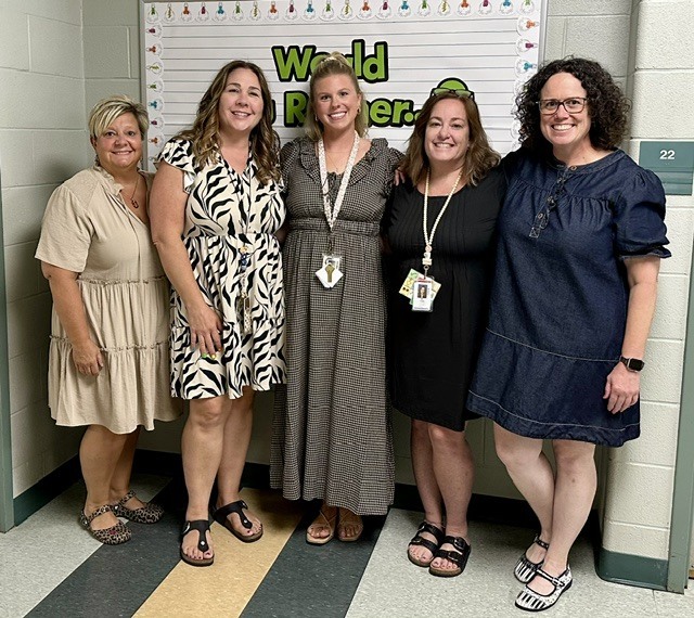 group of women posing together and smiling