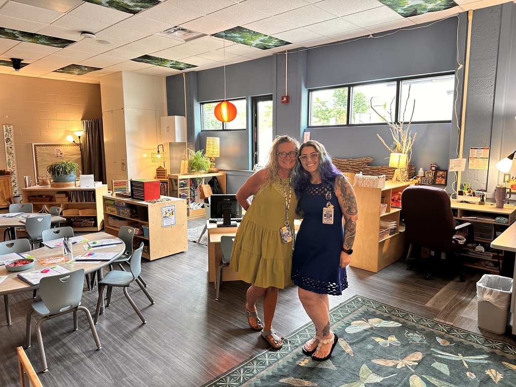 2 women posing in a preschool classroom