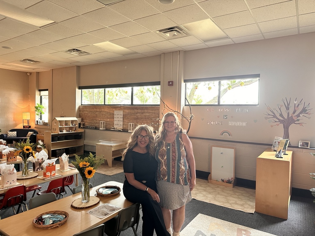 2 women posing in a preschool classroom