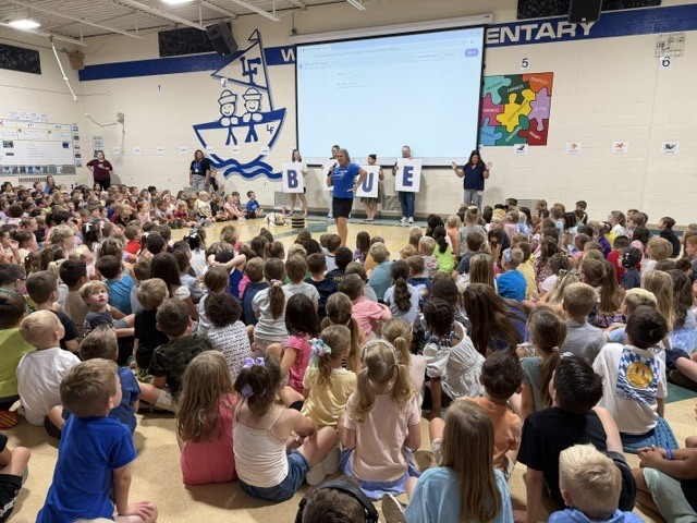 students at a school assembly