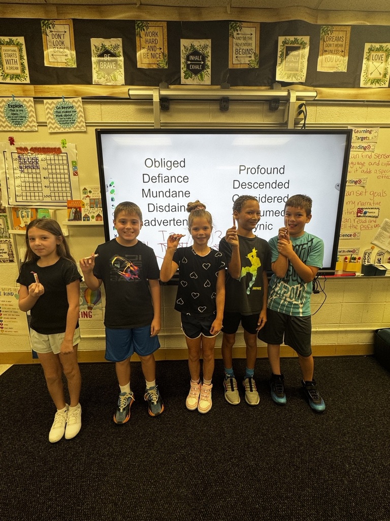 5 kids holding up Smarties candy