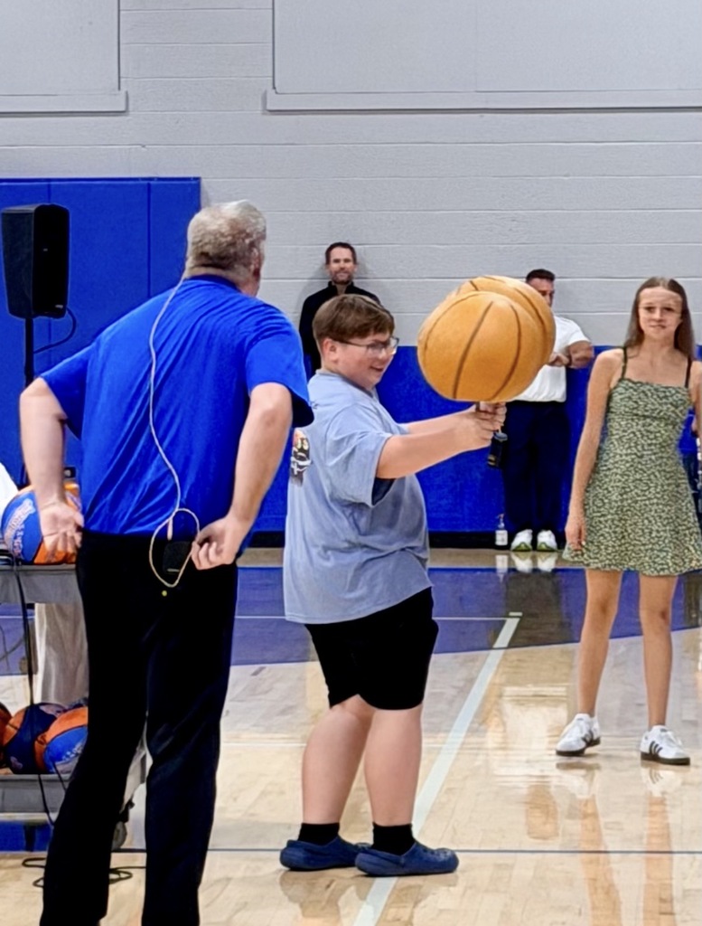 boy spinning a basketball 