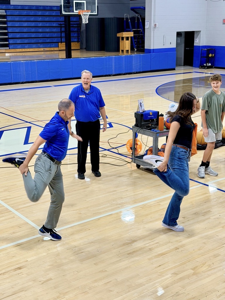 teachers dancing in a gym