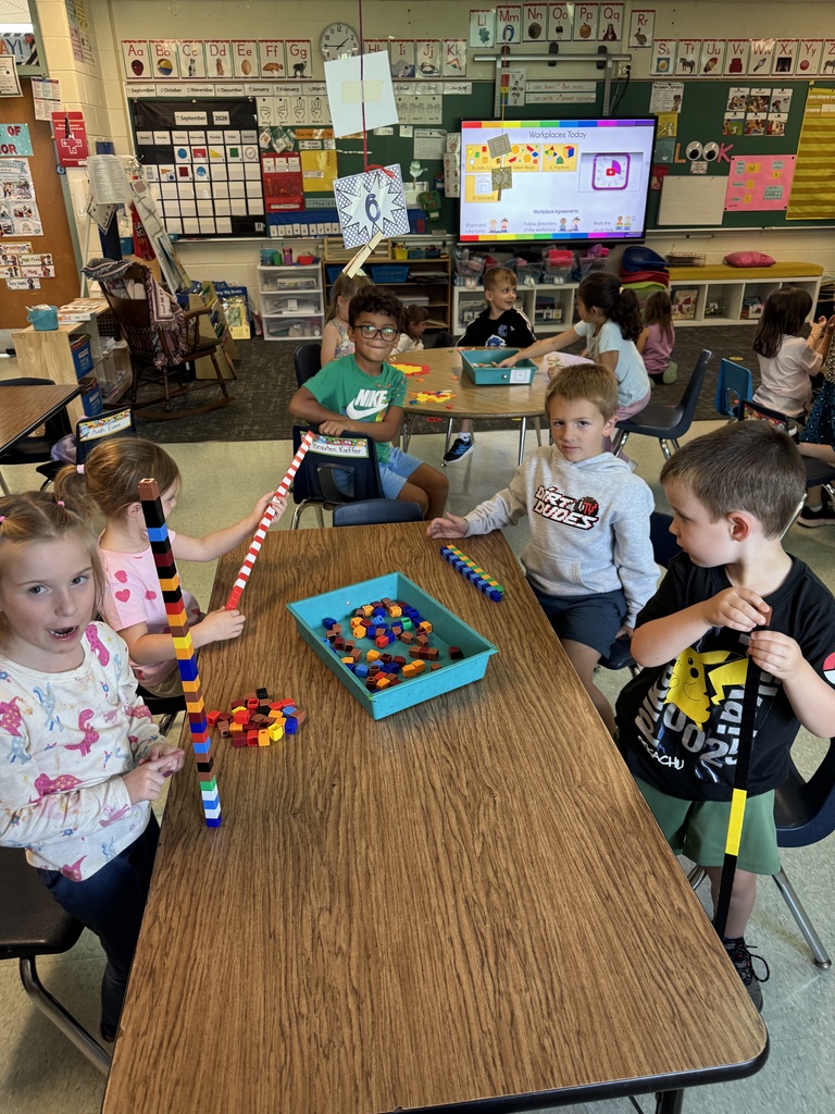 kids playing with brightly colored blocks in a classroom