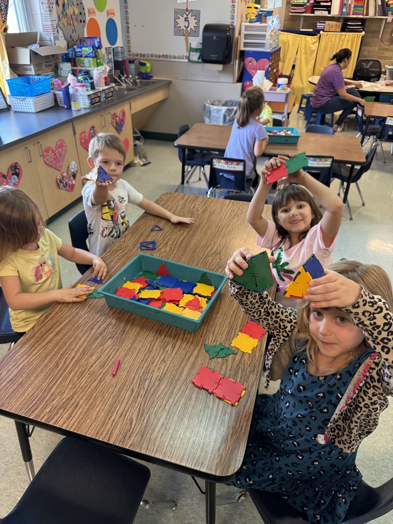 kids playing with brightly colored blocks in a classroom