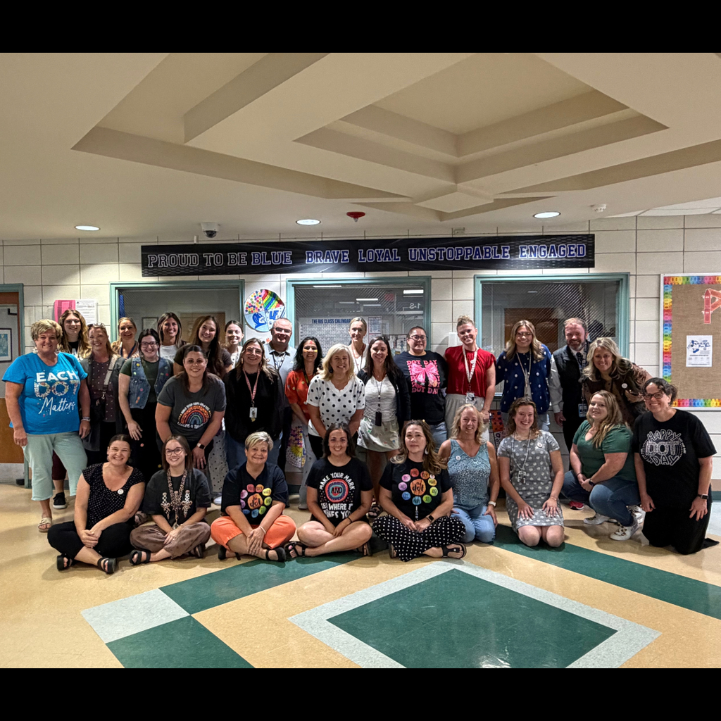 group of elementary school staff posing for a group picture