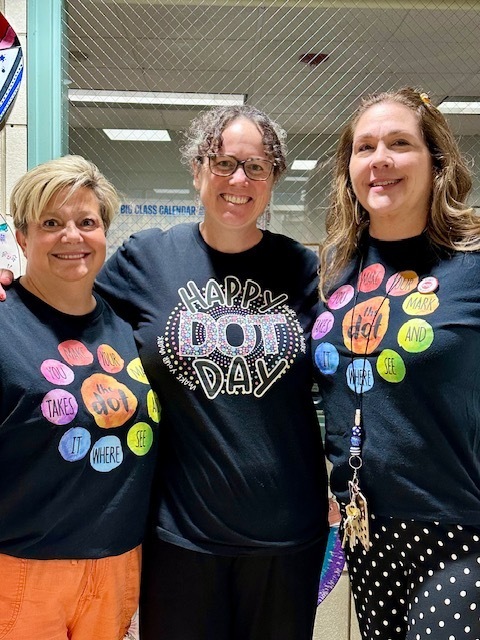3 teachers posing in Dot Day shirts