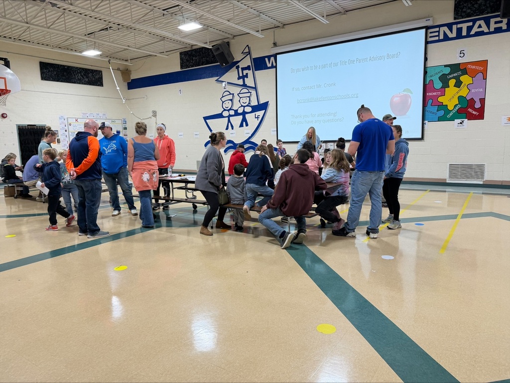 group of parents in a school gym