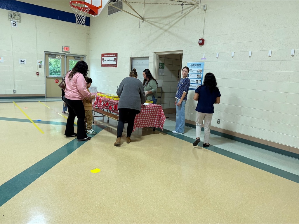 group of parents in a school gym