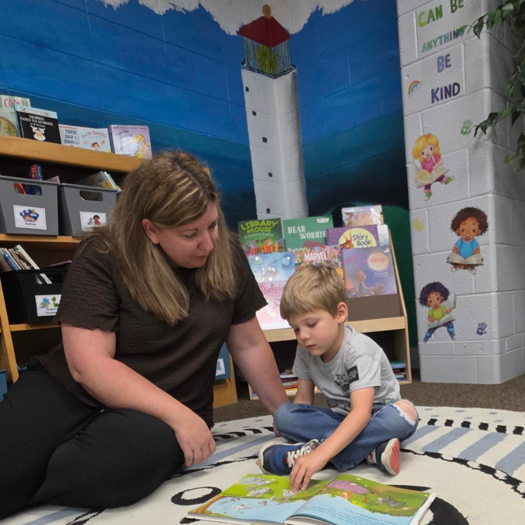 woman reading to little boy