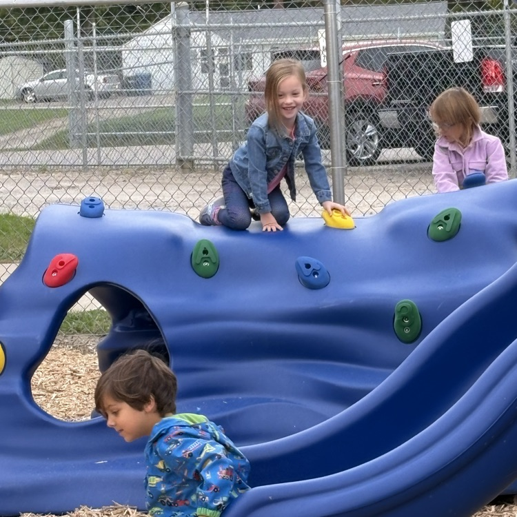 kids playing on a blue climbing structure