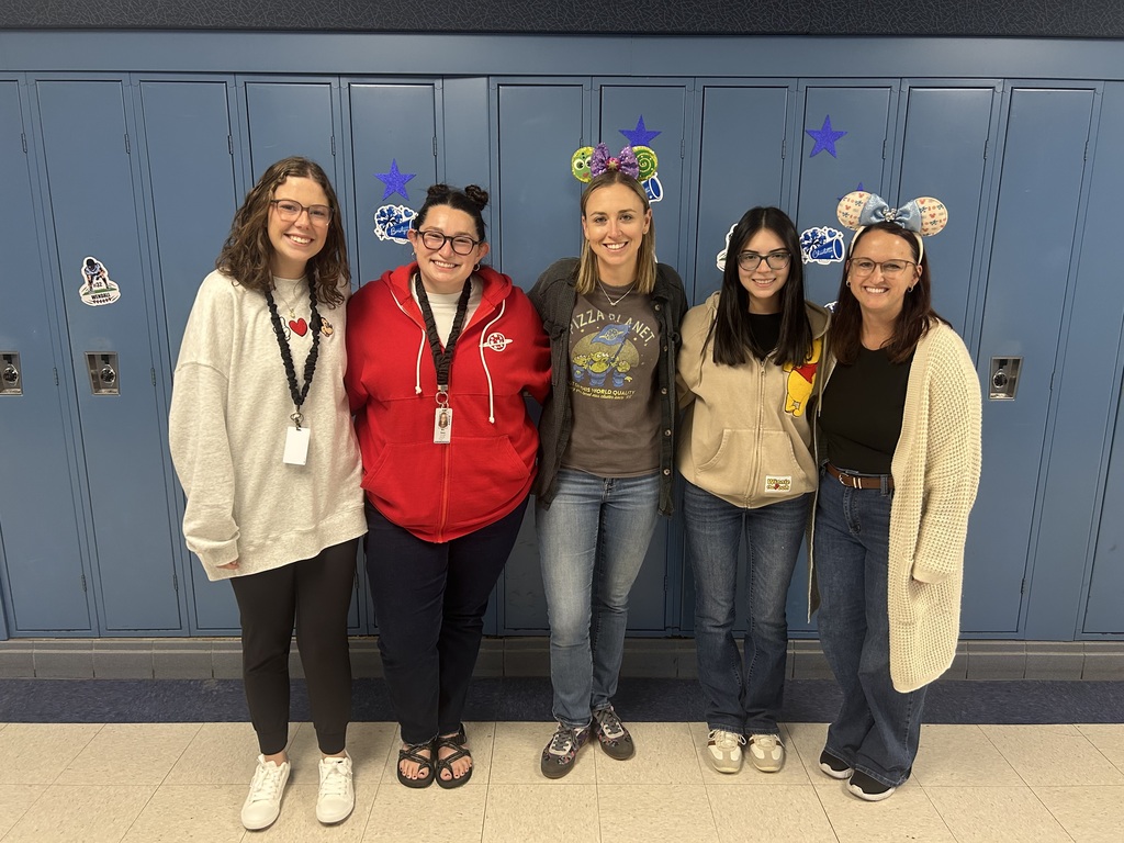 group of 5 girls posing in mouse ears