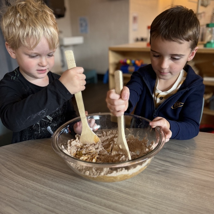 preschoolers mixing batter in a bowl
