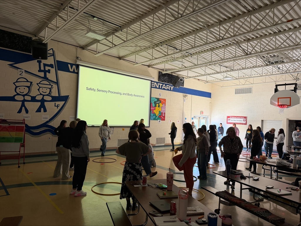 group of teachers in a gym