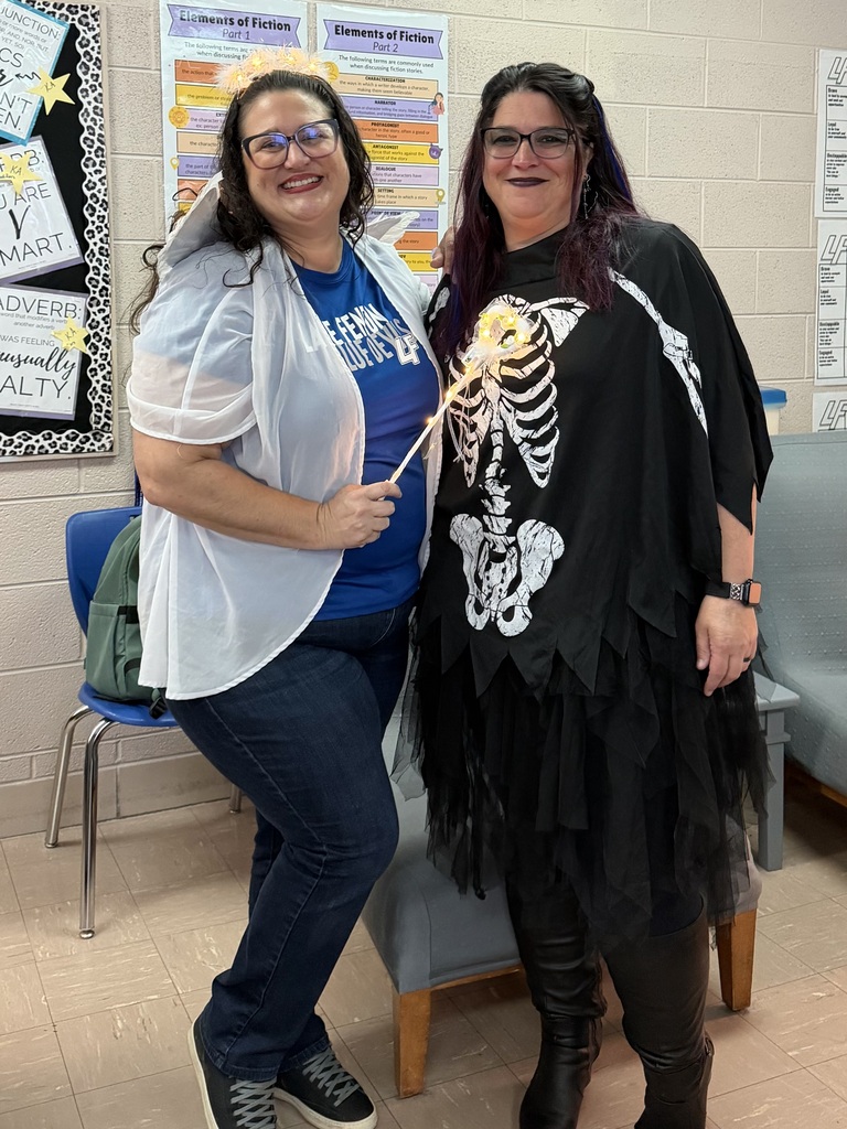 2 women posing in halloween costumes
