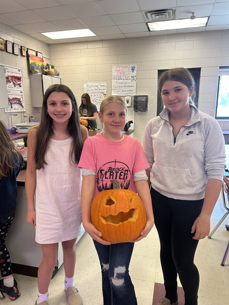 Students with carved pumpkins