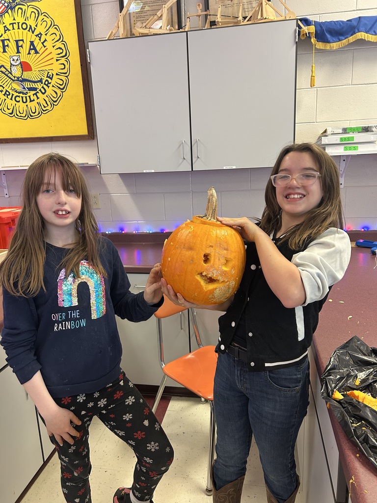 Students with carved pumpkins