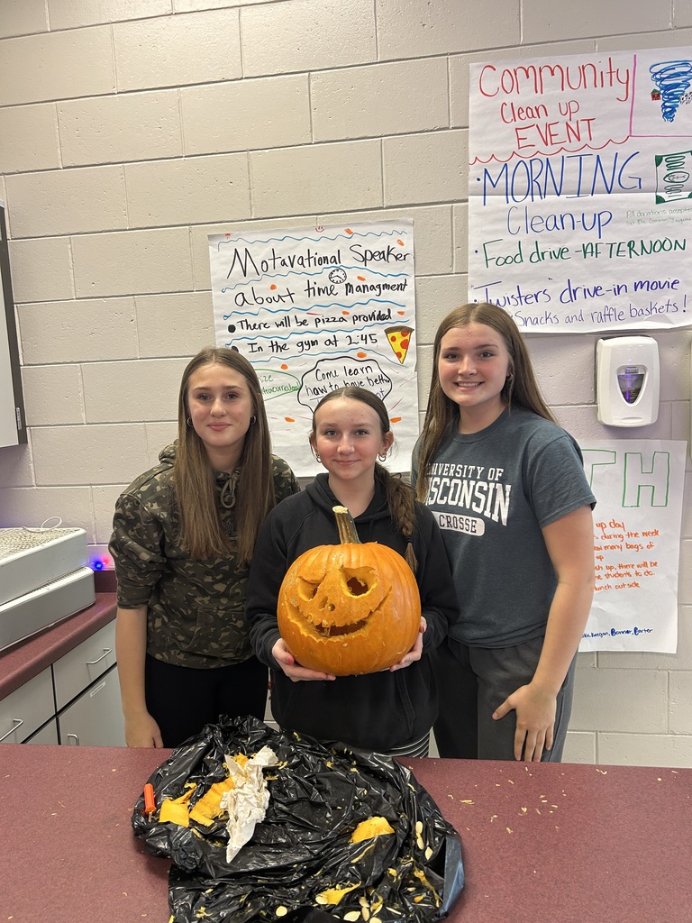 Students with carved pumpkins