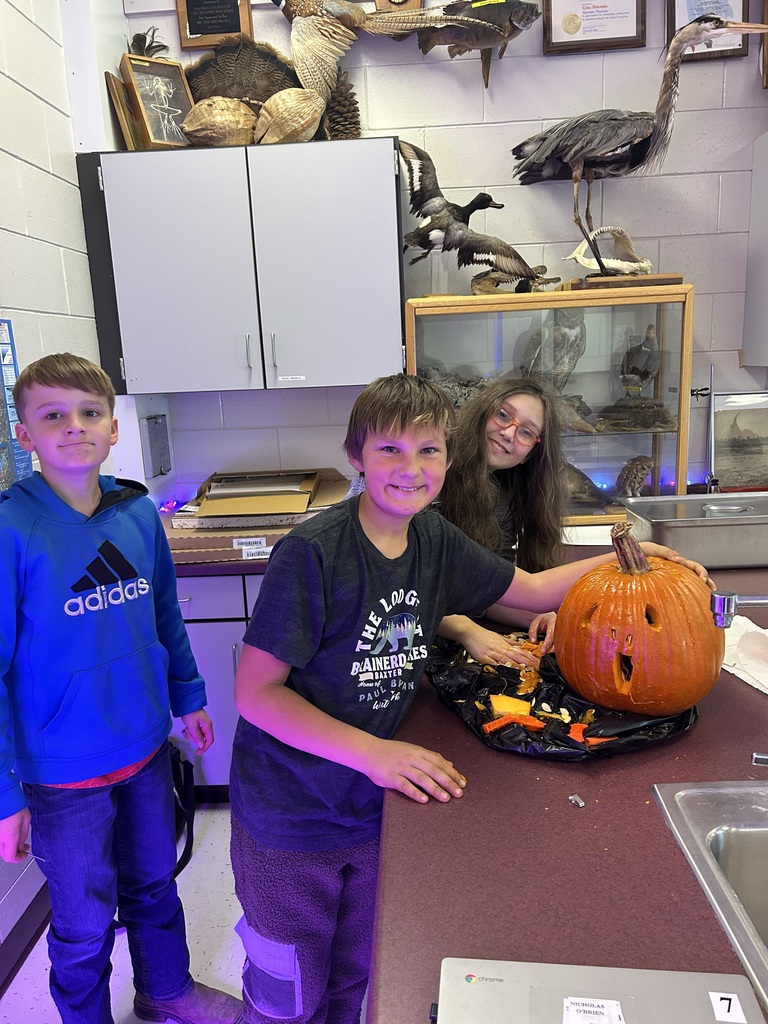 Students with carved pumpkins