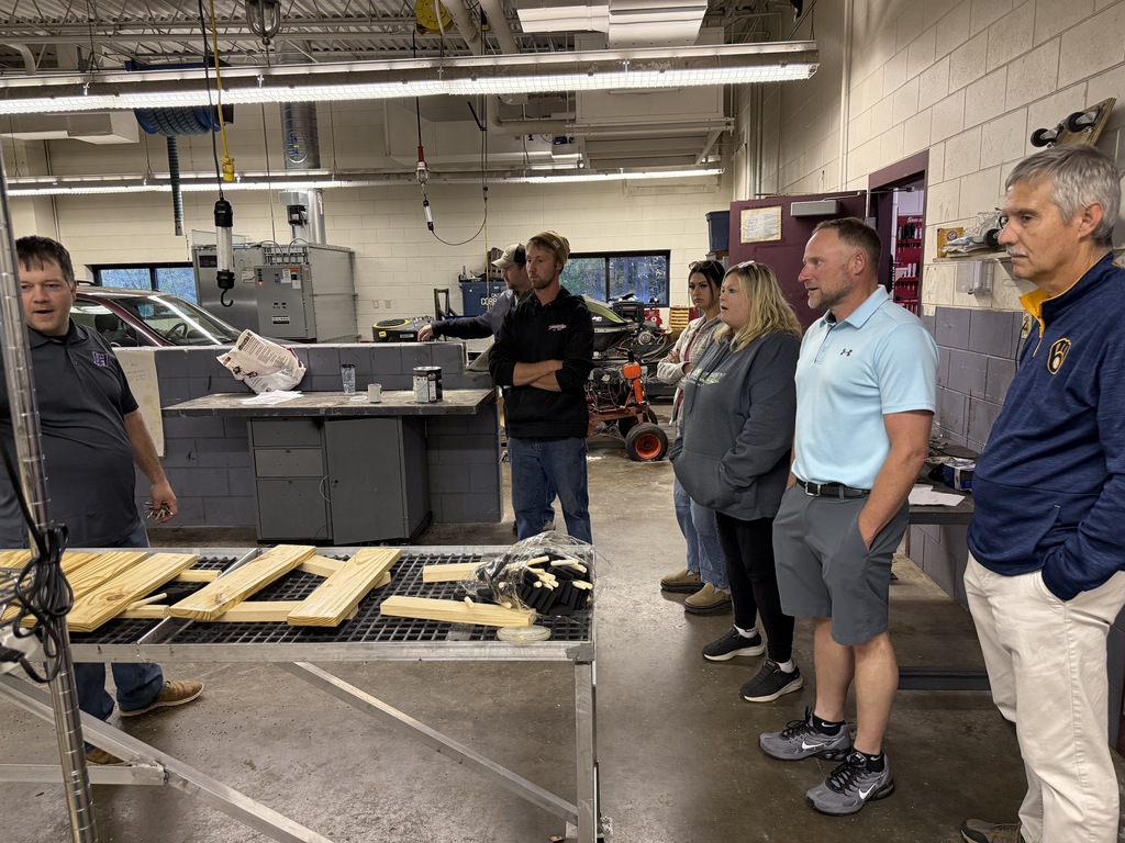 business owners listening to tech ed instructor