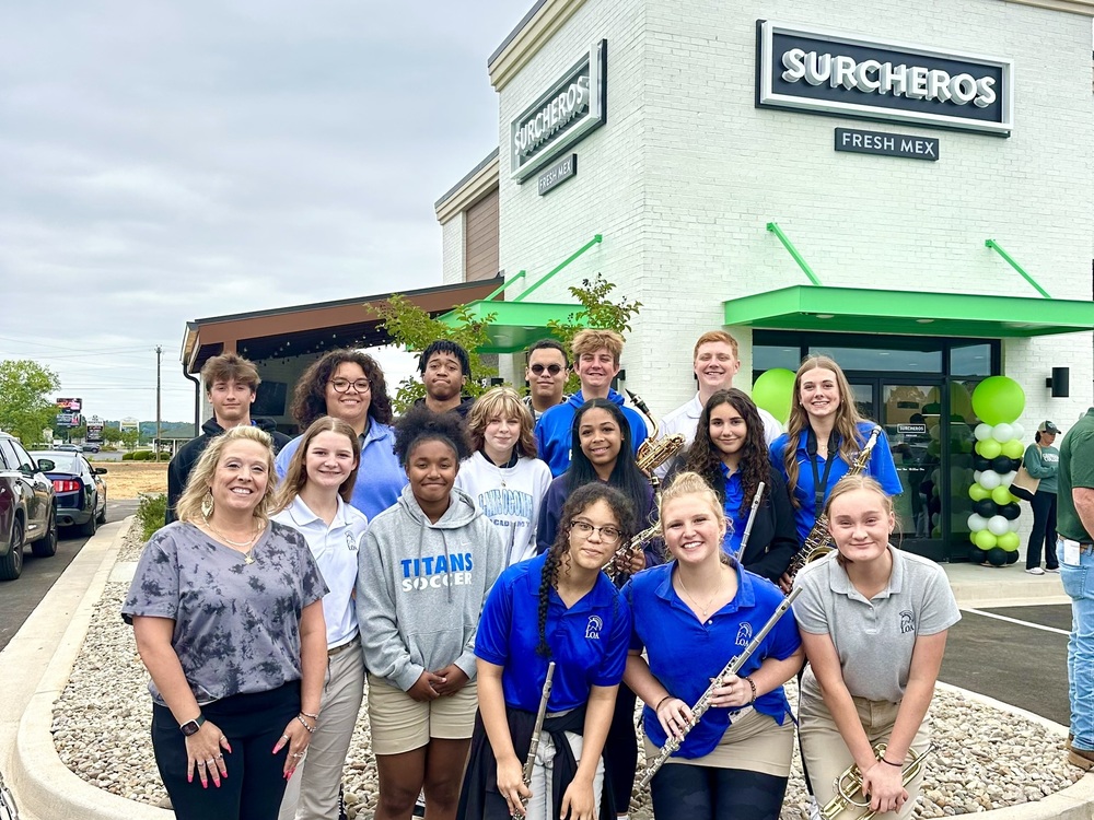 band members at the grand opening