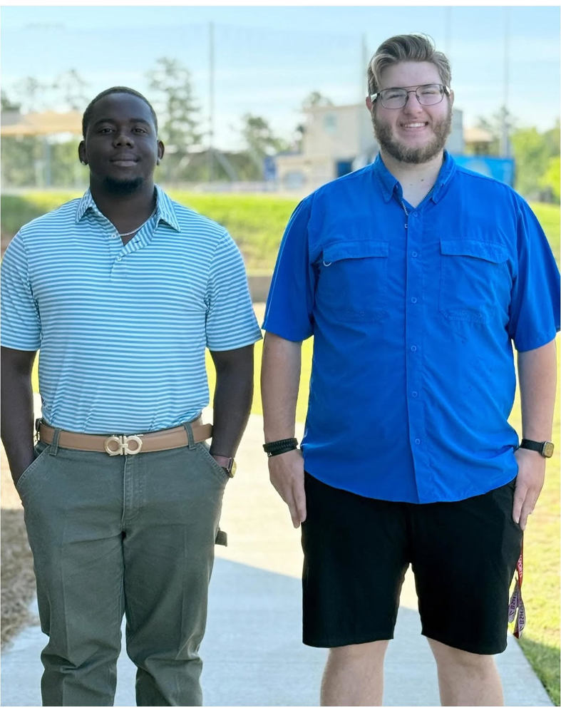 Coby and Logan standing outside