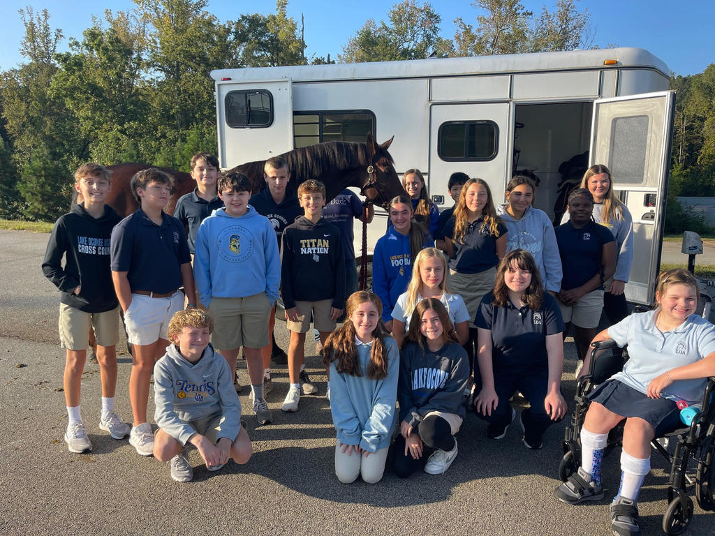 Class outside with horse